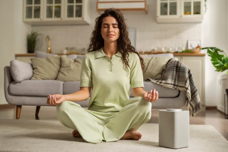 full-shot-woman-meditating-home (1)